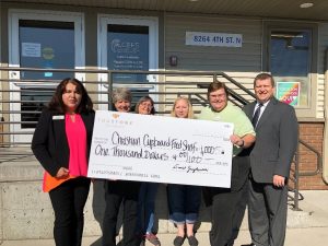 Staff from the Oakdale branch of TruStone Financial presented a check for $1,000 to CCEFS staff at the organization’s food shelf in Oakdale.