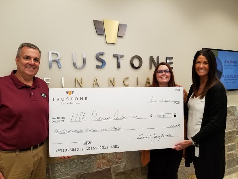 Staff from the ELCA Outreach Center accepted the $1,000 donation at TruStone Financial’s Green Bay Road branch.
