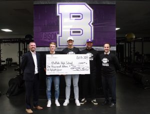 Hans Iverson, Chief Operating Officer at TruStone Financial, presented a check for $1,000 to members of the Buffalo High School boys’ football team for their Hot Highlights win.