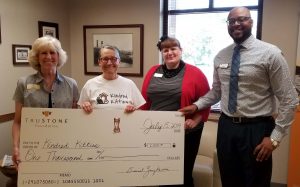 Staff from Kindred Kitties accepted the $1,000 donation at TruStone Financial’s Northside Kenosha branch.