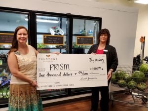 Staff from the Golden Valley branch of TruStone Financial presented a check for $1,000 to PRISM staff at the organization’s food shelf in Golden Valley.