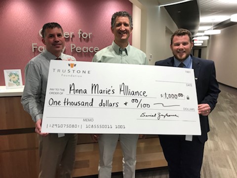 Staff from TruStone Financial’s St. Cloud branch presented the $1,000 donation to Anna Marie’s Alliance staff at the organization’s offices in St. Cloud.